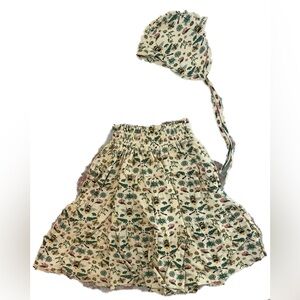 Kate Quinn litho bee smocked maxi skirt and flight hat bonnet.